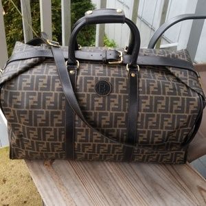 Authentic Fendi travel bag with lock and strap